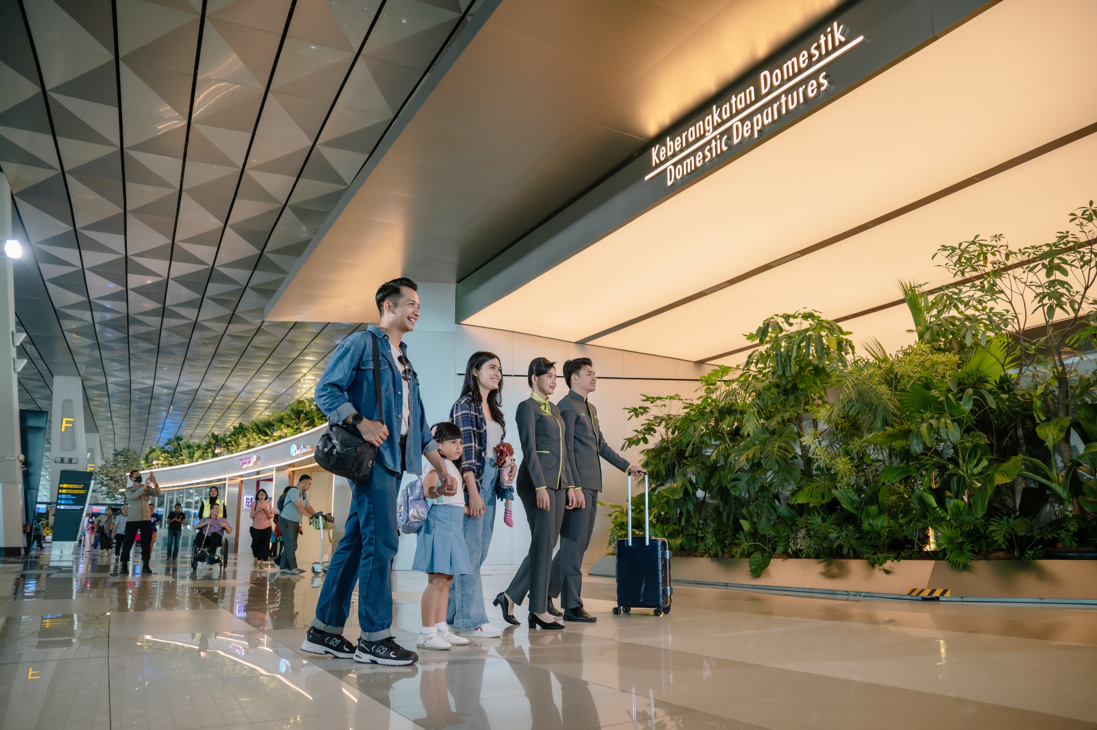 Airport terminal with staff assisting passengers